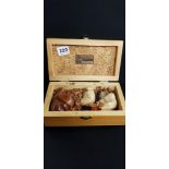 BOX OF CARVED PIPES