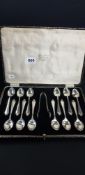 CASED SET OF 12 SILVER SPOONS AND PAIR OF SILVER SUGAR TONGS - SHEFFIELD 1929/30