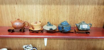 5 MINIATURE ORIENTAL TEAPOTS ON STANDS