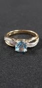 9CT YELLOW GOLD BLUE TOPAZ AND DIAMOND RING