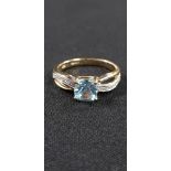 9CT YELLOW GOLD BLUE TOPAZ AND DIAMOND RING
