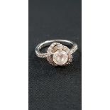 18CT GOLD HALO RING WITH DIAMONDS TO SHANK - MAIN STONE IS NOT A DIAMOND