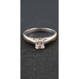 18CT WHITE GOLD AND DIAMOND SOLITAIRE RING