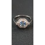 PLATINUM SET AQUA (0.70CT) AND DIAMOND (0.30CT) CLUSTER RING