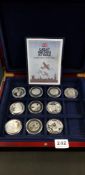 10 CASED SILVER COINS FROM THE GREAT BRITAIN AT WAR SILVER COIN COLLECTION