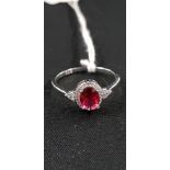 SILVER OVAL CUT SYNTHETIC RUBY & CZ RING