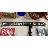 STABLE BELT OF MILITARY BADGES ETC