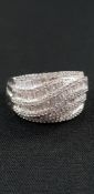 WHITE GOLD AND DIAMOND TWIST STYLE RING