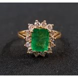 18 CARAT YELLOW GOLD EMERALD & DIAMOND RING WITH HALF CARAT OF DIAMONDS & 2 CARAT EMERALD