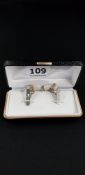 PAIR OF SILVER CUFF LINKS