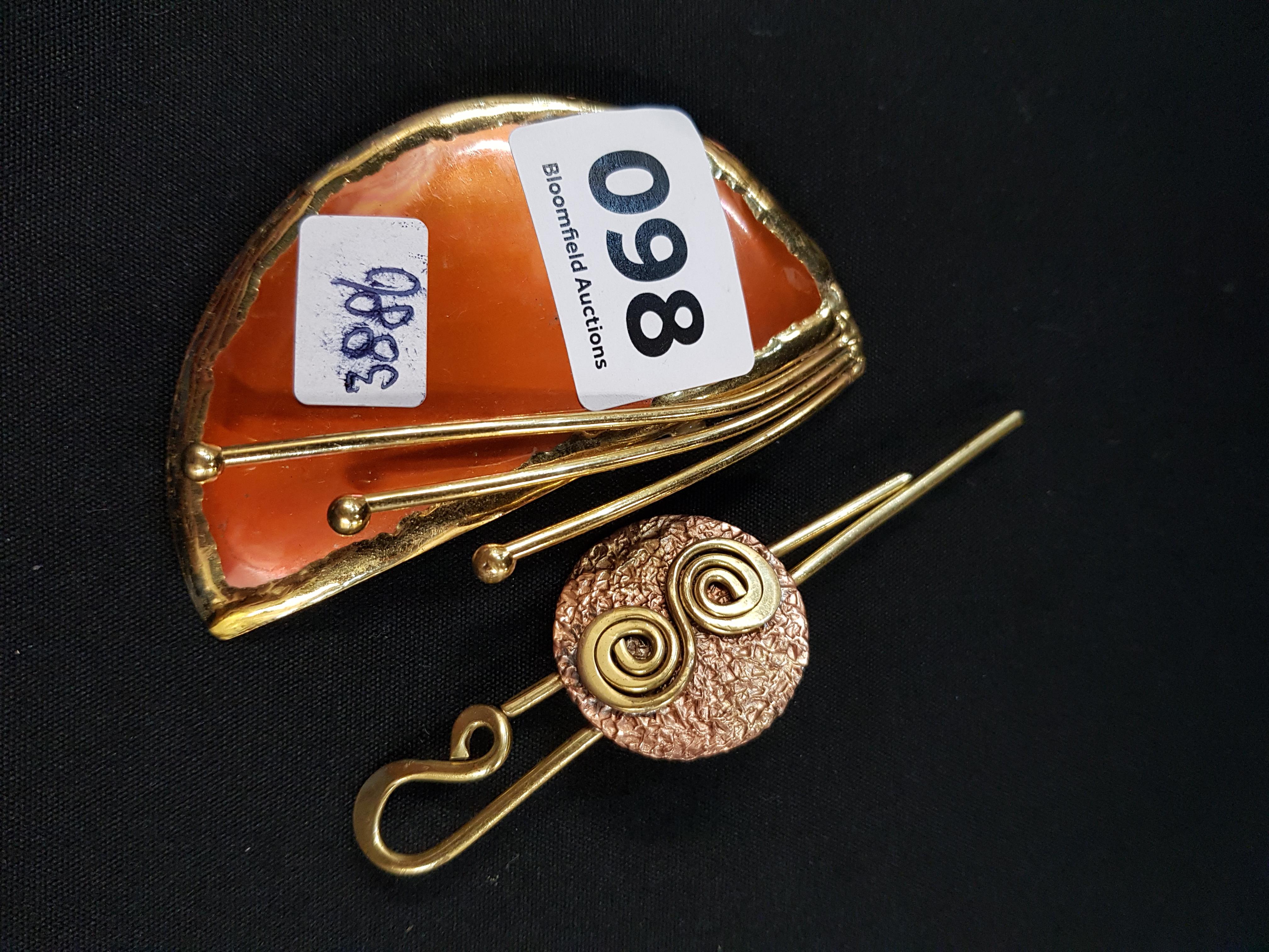 PAIR COPPER DESIGNER BROOCHES