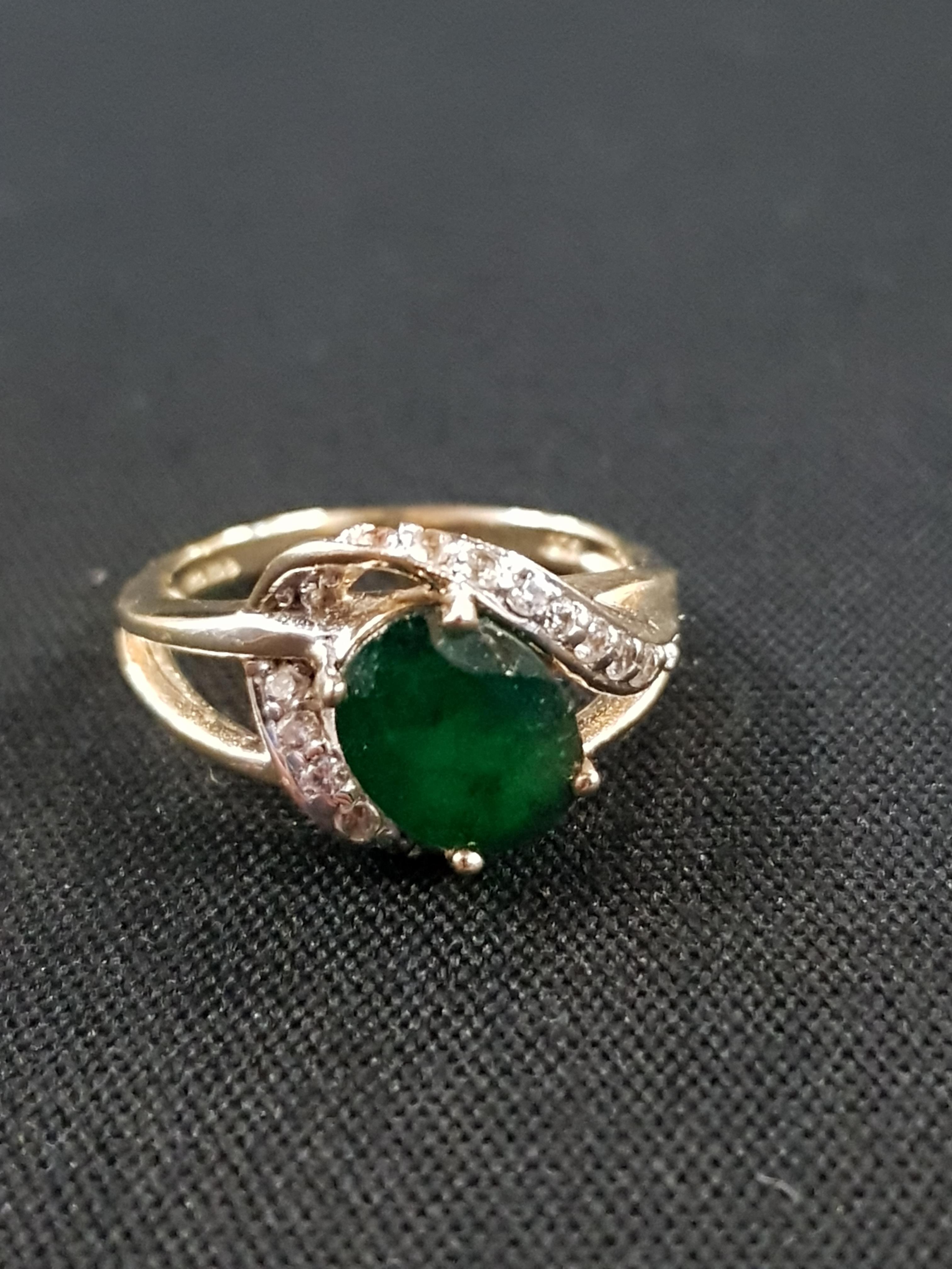 GOLD EMERALD AND DIAMOND RING