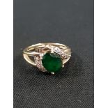 GOLD EMERALD AND DIAMOND RING