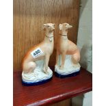 PAIR OF VICTORIAN STAFFORDSHIRE GREYHOUNDS A/F