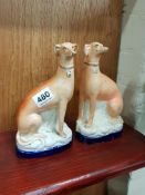 PAIR OF VICTORIAN STAFFORDSHIRE GREYHOUNDS A/F