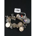 HEAVY SILVER CHARM BRACELET WITH ASSORTED COINS & CHARMS