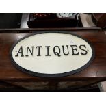 CAST IRON ANTIQUES SIGN