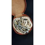 LEATHER CASE OF PEARL NECKLACES