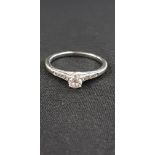 WHITE GOLD DIAMOND SOLITAIRE RING WITH DIAMOND SHOULDERS
