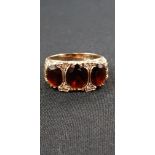 9 CARAT GOLD 3 STONE GARNET RING