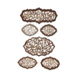 Six Qur'anic plaques, cut-steel with silver overlay [Eastern Ilkhanate provinces, c. 1380]