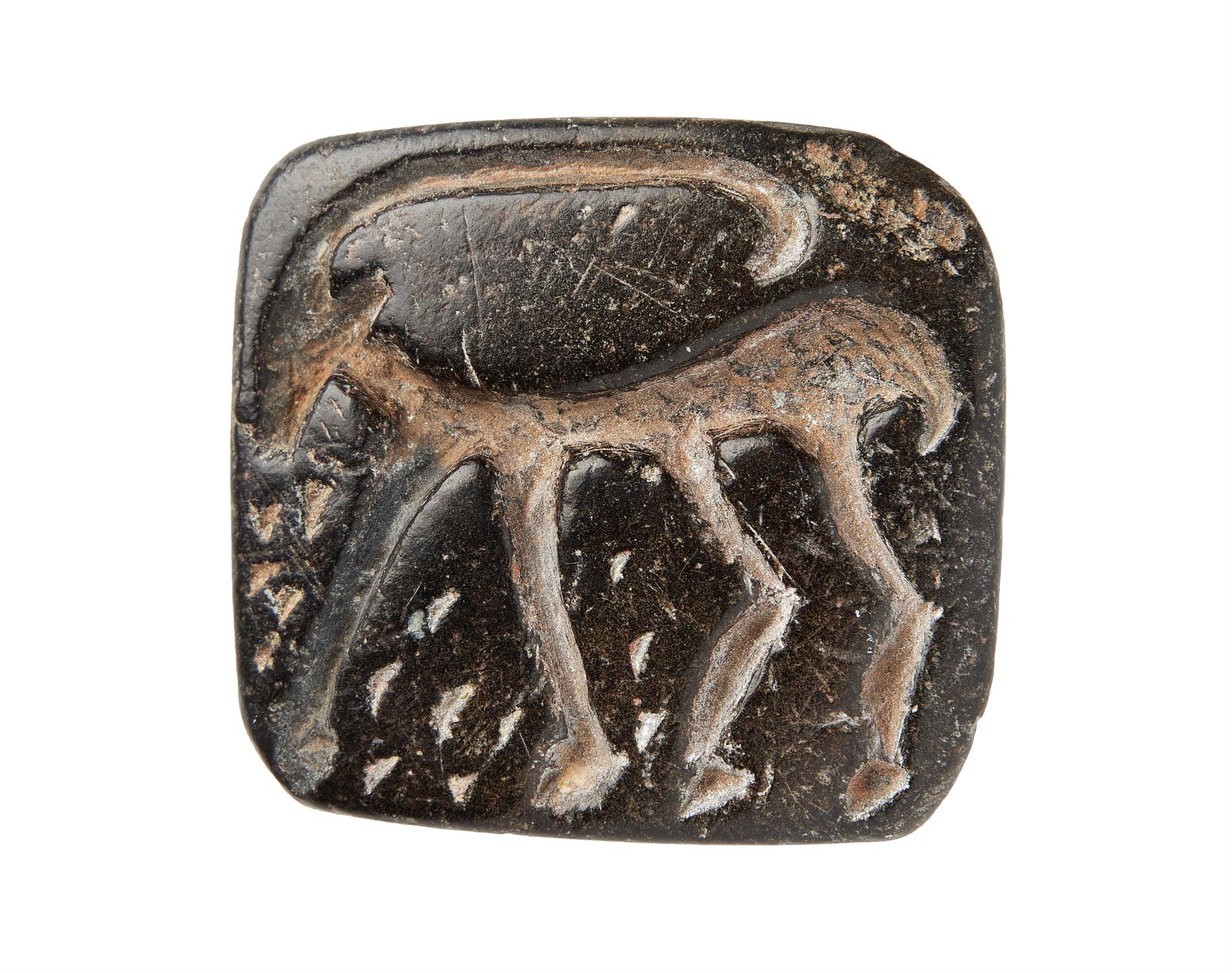 ‡ Stamp seal with Ibex, carved on black steatite or chlorite [Near East, fourth millennium BC.]