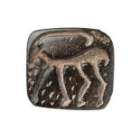 ‡ Stamp seal with Ibex, carved on black steatite or chlorite [Near East, fourth millennium BC.]