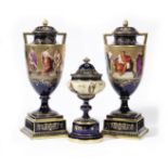 A pair of Vienna-style vases and covers and another Vienna-style vase and cover Circa 1900