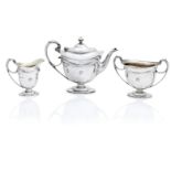 A three piece silver tea service by Martin Hall & Co Ltd, Sheffield 1906/10