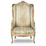 A late 19th century giltwood and gesso wingback armchair