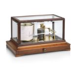A late 19th/early 20th century brass lacquered and mahogany cased barograph With applied ivorine ...