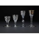 Three facet-stem wine glasses and a firing glass Circa 1770