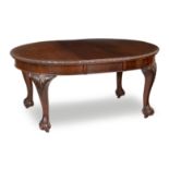 An early 20th century mahogany extending dining table