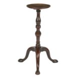 An 18th century and later mahogany kettle stand