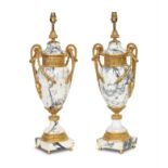 A pair of gilt metal mounted variegated white marble electric table lamps, 20th century (2)