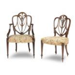 A set of four 20th century mahogany Hepplewhite style chairs (4)