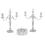 A pair of electroplated three-light candelabra and an egg epergne unmarked
