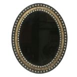 An early 19th century Irish oval wall mirror