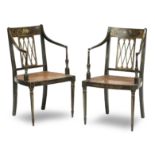 A pair of George III ebonised and floral painted open armchairs (2)