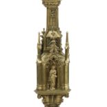 A 19th century Gothic Revival brass pricket candlestick, in the manner of A.W.N. Pugin