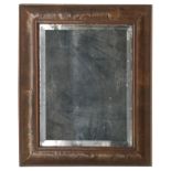 An early 18th century walnut cushion framed wall mirror