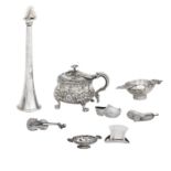 A collection of silver vertu to include a table lighter in the form of a hunting horn by Grey & C...