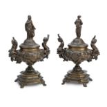 A pair of French late 19th Century bronze pedestal urns with covers (2)