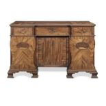 A George III mahogany, purplewood, chequer banded and marquetry kneehole desk almost certainly ma...