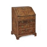A George I stained field maple ('Mulberry' wood) and featherbanded bureau of small proportions