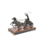 A late 19th century French or Italian patinated bronze model of a chariot and rider