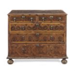 A William and Mary walnut, fruitwood and oyster veneered chest