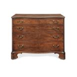 A George III mahogany serpentine commode