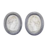 A pair of Italian 'Grand Tour' carved white marble oval profile portrait reliefs of Flavia and Pl...