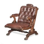 An unusual Victorian mahogany library armchair with an adjustable head rest
